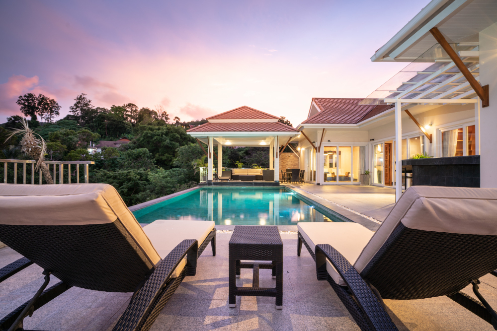 home-house-exterior-design-showing-tropical-pool-villa-with-sun-bed